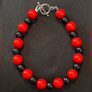 Red & black handcrafted bracelets.